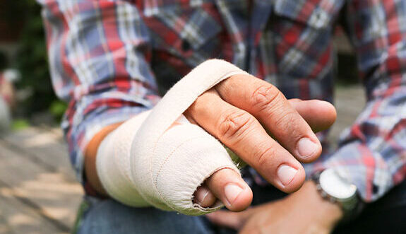 workers comp bandaged hand