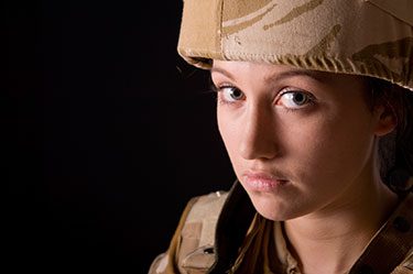 A female soldier in khaki uniform