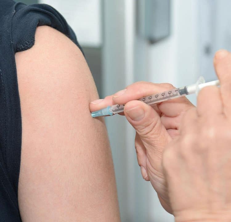 A patient receives a vaccine