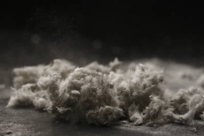 Asbestos fibers on a dark background