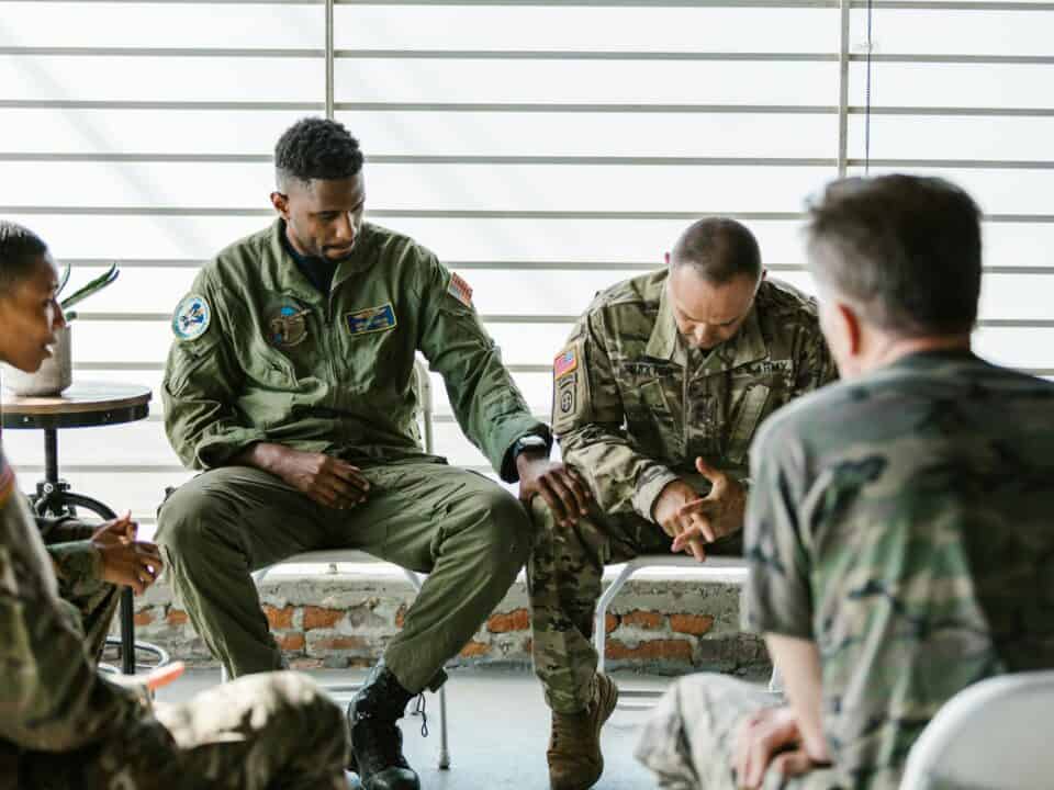 Supportive setting — veteran in conversation or contemplation, nothing clinical